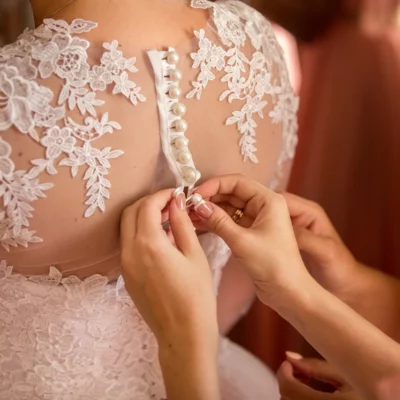Bridesmaid Preparing Bride 1