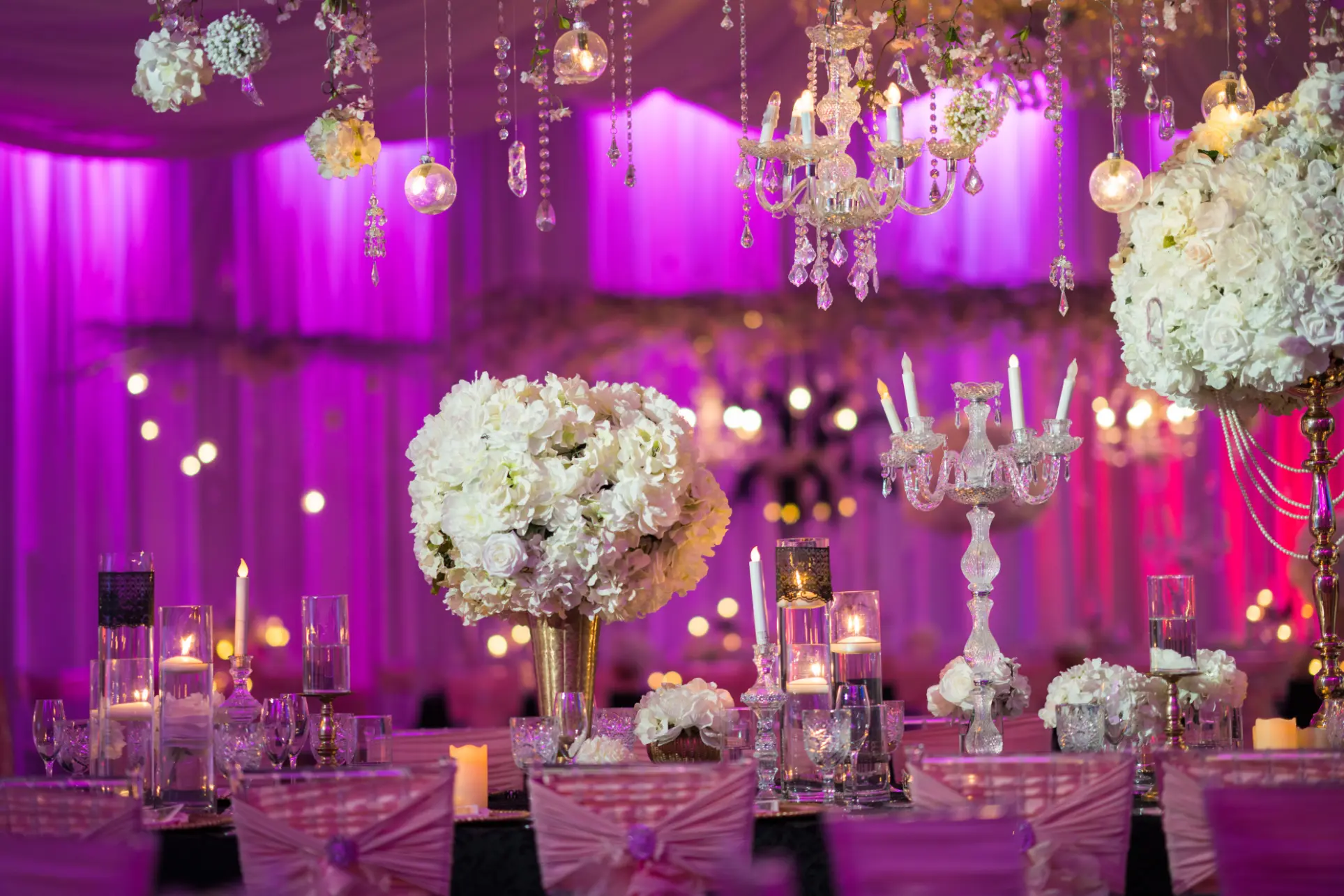 Glamorous wedding décor with purple, orange, and gold accents